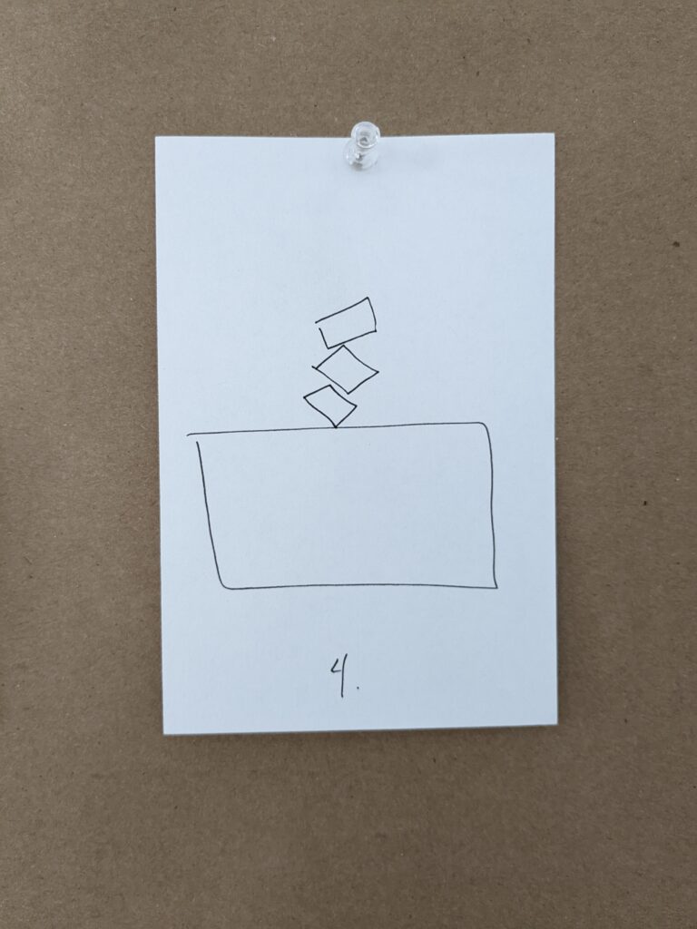 an image of a white card pinned to a brown board with a clear pushpin. on the card is drawn, in black pen, a diagram of a rectangle topped with three off-kilter smaller rectangles. below the diagram is the numeral "4"